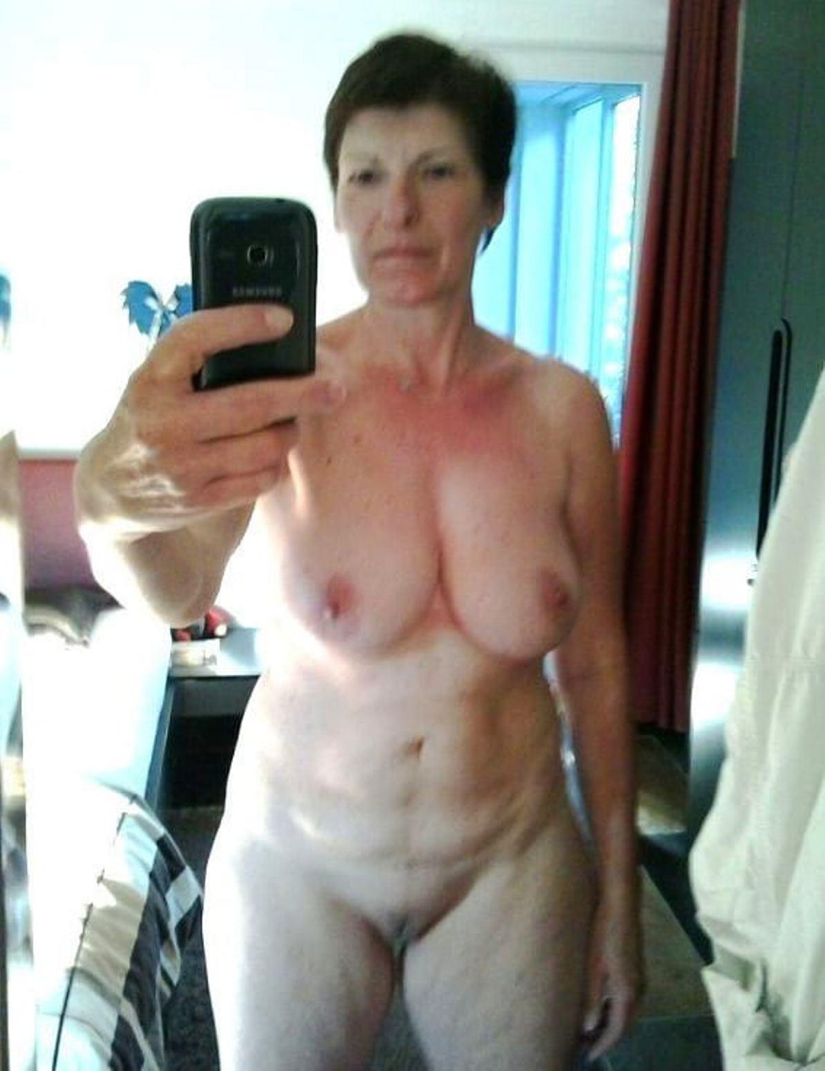 mature topless selfie