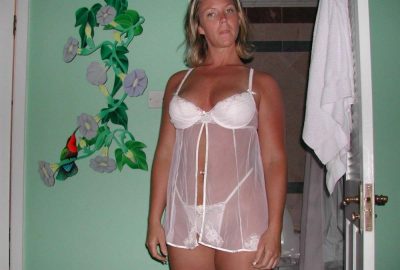 Amateur milf with a perfect natural body awakens men's senses. Very hot mom posing in her sexy lingerie at home